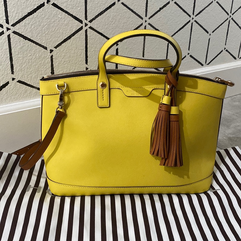 Henri Bendel yellow satchel with shoulder strap.